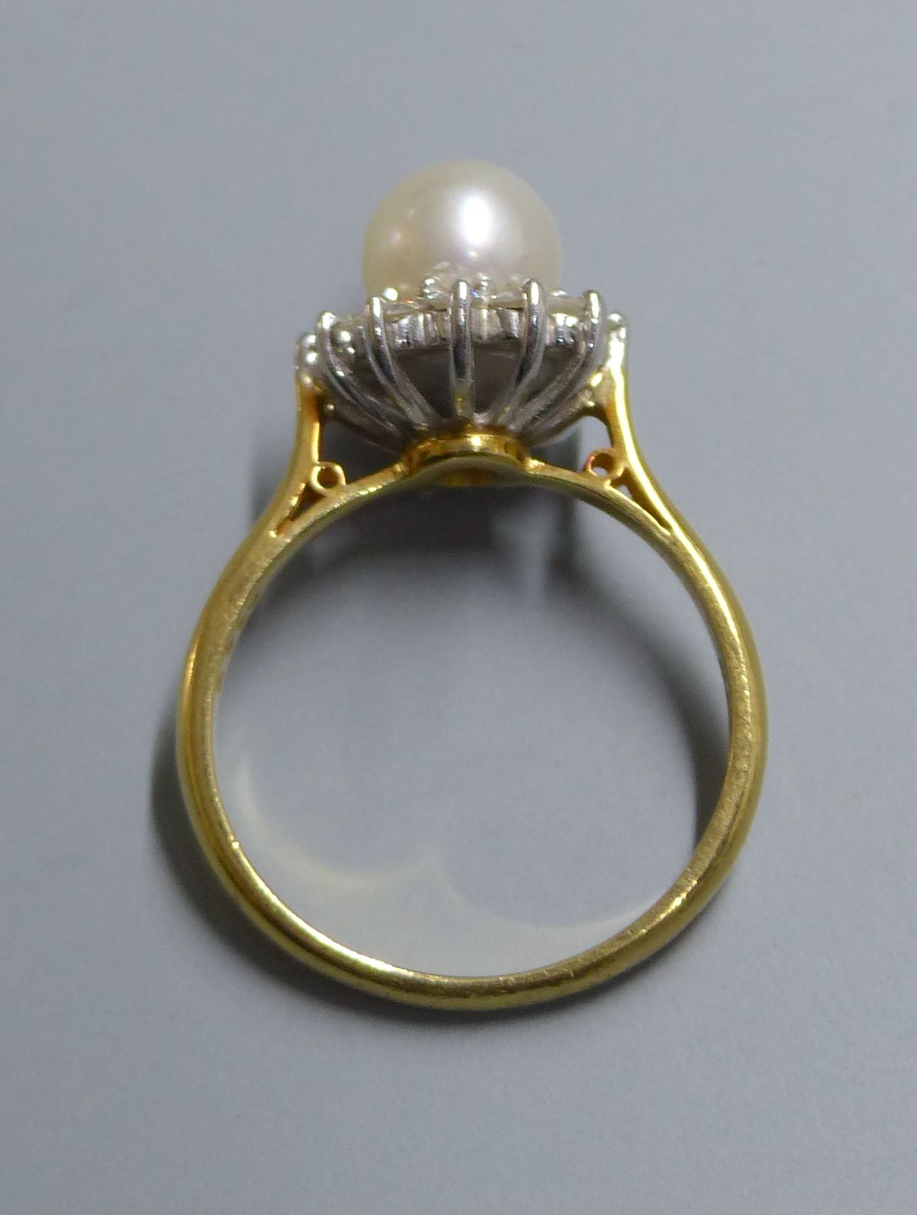 A modern 18ct gold, cultured pearl and diamond set cluster ring, size L, gross 4.4 grams.